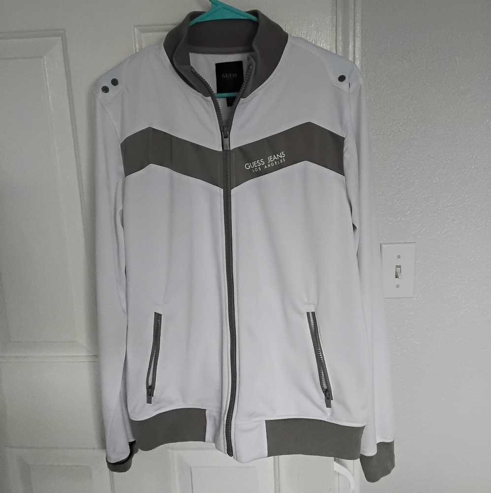 Men's Guess White and Gray Windbreaker with Chevron Accents.